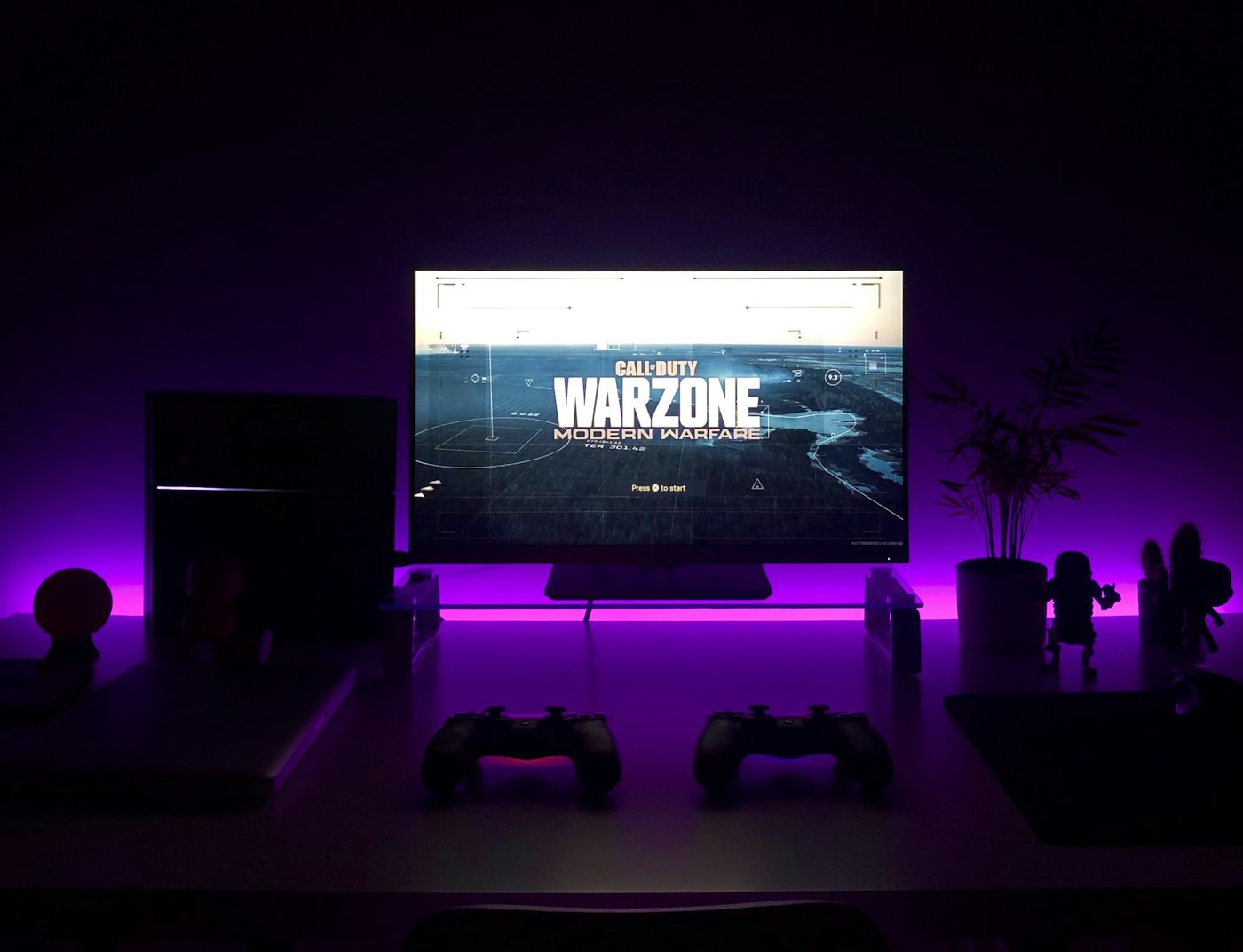 Immersive desk setup with a wide monitor and ambient lighting