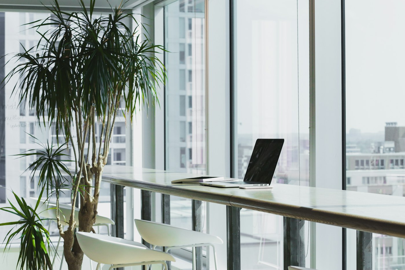 A bright workspace with a desk and comfortable seating